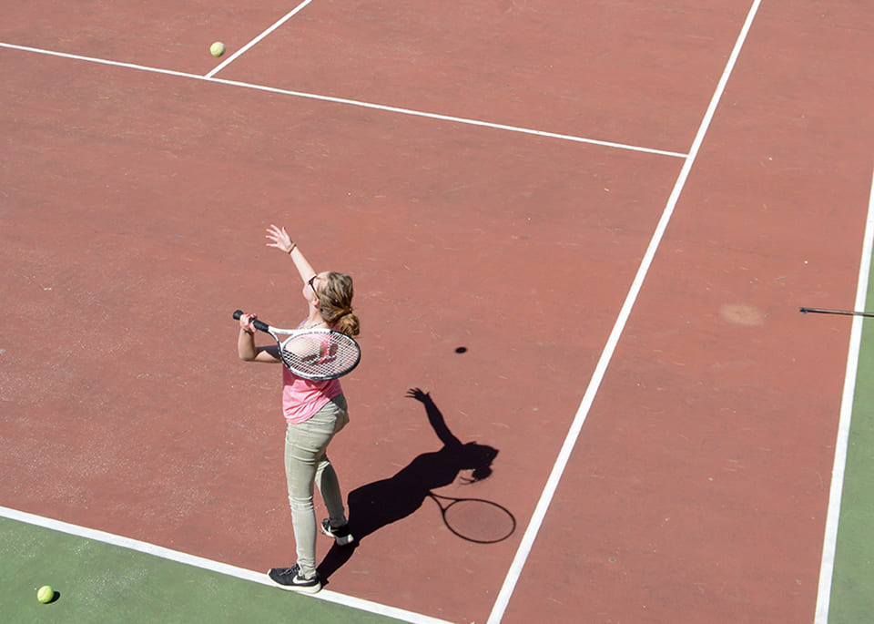 The tennis court in Le Parc campsite in Provence=Alpes-Côte d'Azur, is situated in a huge area of natural woodland.