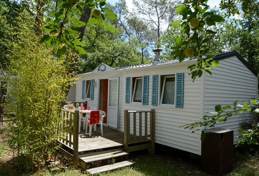 Static caravan rental in Provence-Alpes-Côte d'Azur in  Le Parc campsite, static caravan Sympa and its outside terrace in the heart of 3.5 hectares of woodland
